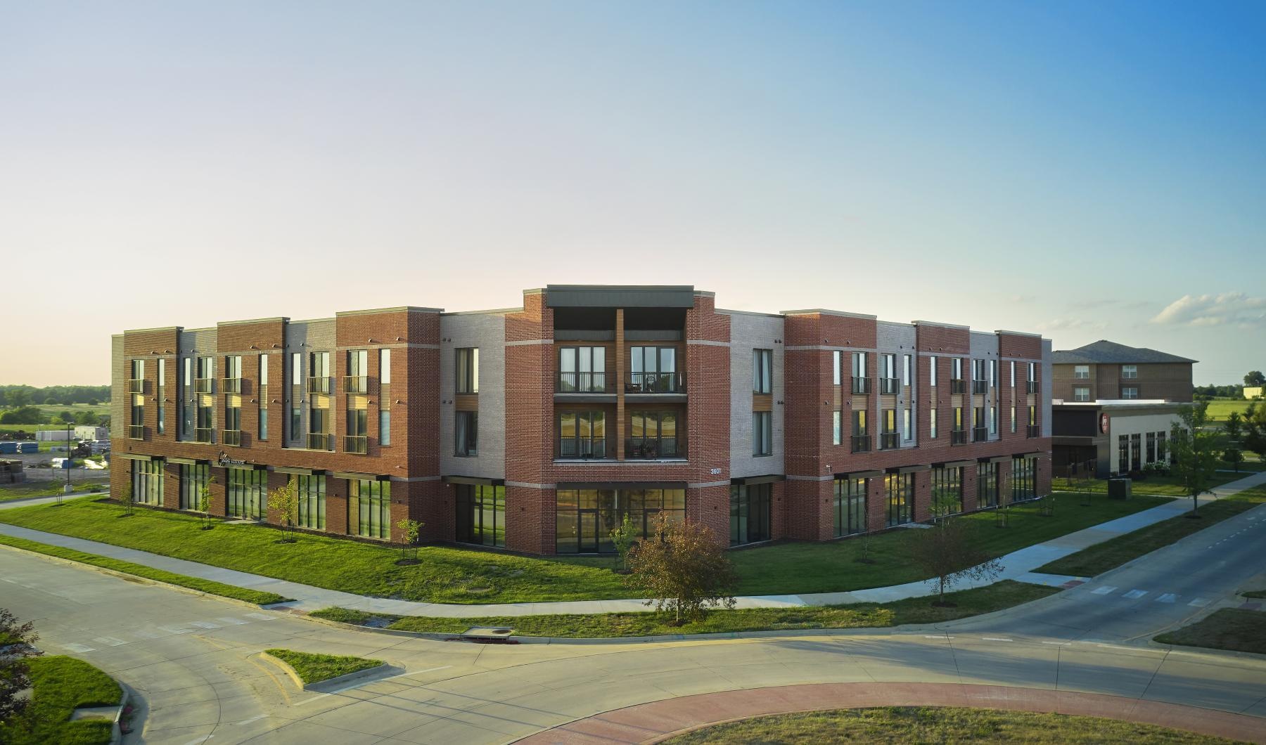 a large building with roads in front