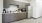 a kitchen with a fridge and microwave