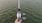 a person fishing on a dock