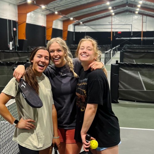 a group of women posing for a picture